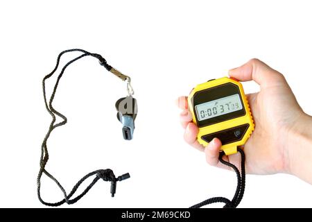 Stopwatch in the hand and  sports whistle. Isolated on white Stock Photo