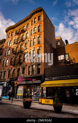 Historical buildings with fire escape stairs, The Bowery, a historic neighbourhood  in the Lower East Side of Manhattan, New York City, USA Stock Photo