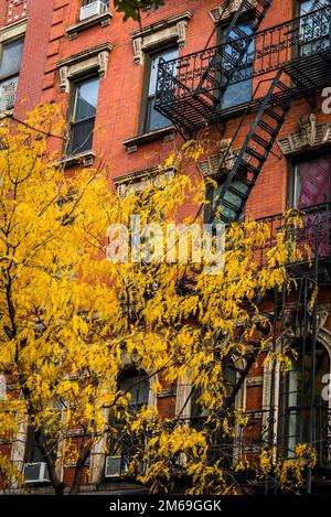 Historical buildings with fire escape stairs, The Bowery, a historic neighbourhood  in the Lower East Side of Manhattan, New York City, USA Stock Photo