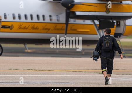 Sgt. 1st Class Ryan Reis of the U.S. Army Parachute Team prepares to board the C-147A aircraft to make a tandem skydive over Aguadilla, Puerto Rico on 21 April 2022.   USAPT is conducting skydives in their first tandem camp of the 2022 season. Stock Photo