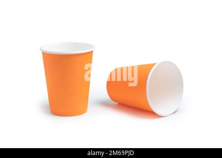 Two orange paper cups on an white background, take away coffee concept Stock Photo