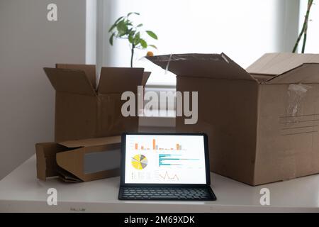 Shopping online e-comerce, Parcel boxes on a laptop. Stock Photo