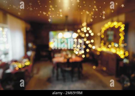 Bokeh Background - Atmospherical Christmas Time Illumination in Family Room Stock Photo