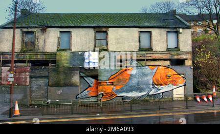 Glasgow, Scotland, UK 3rd January, 2023. UK Weather: Goldfish mural om derelict building Maryhill road.   Freezing temperatures gave way to dreich weather as the streets became wet overnight with light showers. Credit Gerard Ferry/Alamy Live News Stock Photo