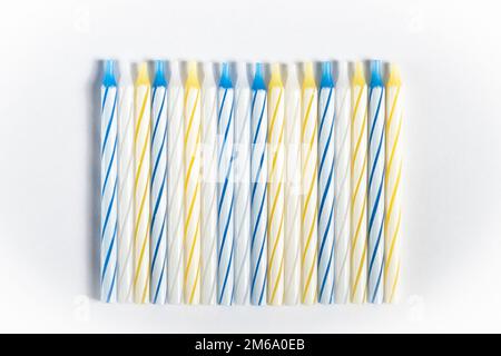 New small holiday candles for cake isolated on white background Stock Photo