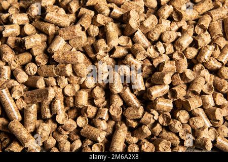 Pile of brown pellets for cat litter background Stock Photo