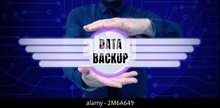 Sign displaying Data Backup. Conceptual photo copy of important data that is stored on an alternative location Stock Photo