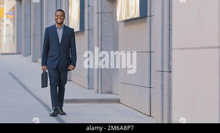 African American man ethnic smiling happy businessman employer entrepreneur boss leader worker investor lawyer male guy company CEO manager in Stock Photo