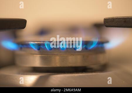 Flame of a gas burner on a kitchen stove, burning gas, fuel prices, energy crisis, high price of gas, inflation Stock Photo