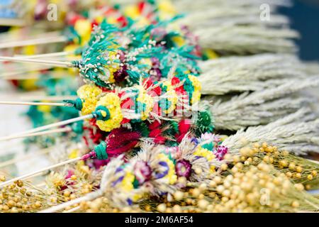 Traditional Lithuanian Easter palms known as verbos sold on Kaziukas, Easter market in Vilnius. Lithuanian capitals annual traditional crafts fair is Stock Photo