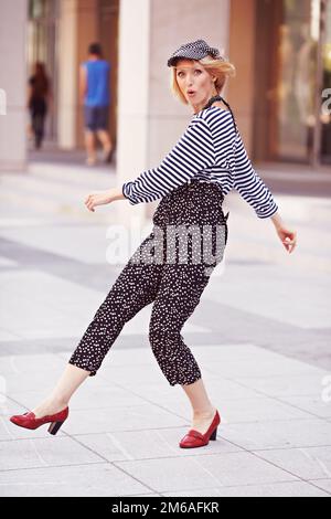 Beautiful girl in the striped vest Stock Photo