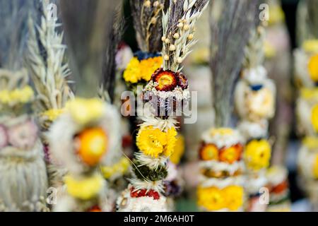 Traditional Lithuanian Easter palms known as verbos sold on Kaziukas, Easter market in Vilnius. Lithuanian capitals annual traditional crafts fair is Stock Photo