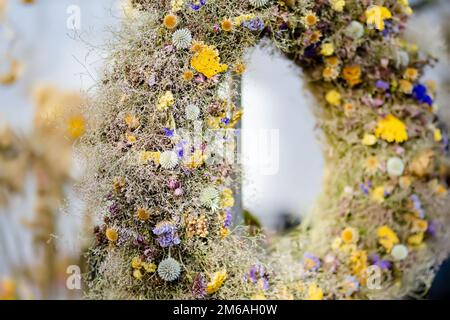 Traditional Lithuanian Easter palms known as verbos sold on Kaziukas, Easter market in Vilnius. Lithuanian capitals annual traditional crafts fair is Stock Photo