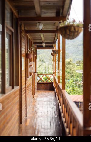 balcony of a hotel during the day, architecture and interior decoration, rustic design with pots, nature in the background, rural area Stock Photo