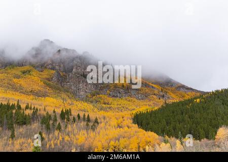 Clouds move across mountain peaks. Stock Photo