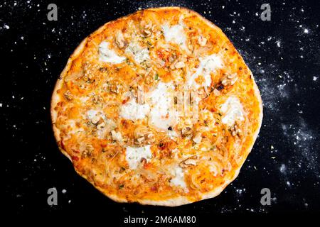 Bufala Mozzarella Pizza. Neapolitan pizza made with tomato sauce, mozzarella cheese and some vegetables. Italian recipe. Stock Photo