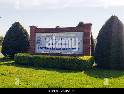 The main Royal Air Force Mildenhall base sign is located close to the main entrance gate near the base visitor's center. The names posted on the sign are that of the base commander and the command chief and they are updated every few years when a change of command occurs. (Photo by U.S. Air Force Staff Sgt. Tarelle Walker). Stock Photo