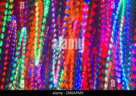 Abstract pattern of beads as colorful lights in vertical zig zag motion Stock Photo