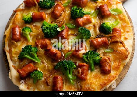 Salami Chistorra Pizza. Neapolitan pizza made with salami, cheese and baked vegetables. Italian vegetarian recipe. Stock Photo