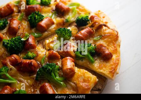 Salami Chistorra Pizza. Neapolitan pizza made with salami, cheese and baked vegetables. Italian vegetarian recipe. Stock Photo