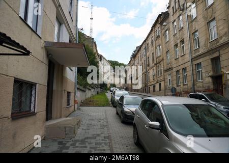 LVIV, UKRAINE - SEPTEMBER 11, 2022 Street view of the historical old city in Lviv, Ukraine. Many old buildings and facade ornaments in tight european style streets of Lviv Stock Photo