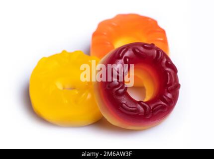 Multicolored jelly candy donuts on a white background. Stock Photo