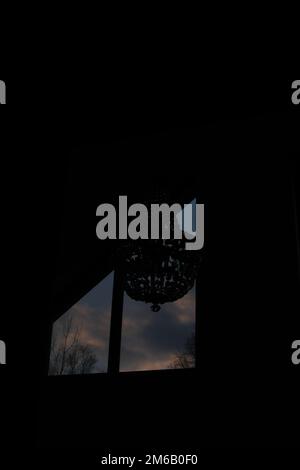 The view from the window of the dramatic sunset sky with clouds. Stock Photo