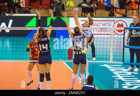 Laura KUeNZLER (Allianz MTV Stuttgart) attacks, Anna LAZAREVA and Eda Erdem DUeNDAR (Fenerbahce Opet Istanbul) block, Volleyball Champions League Stock Photo