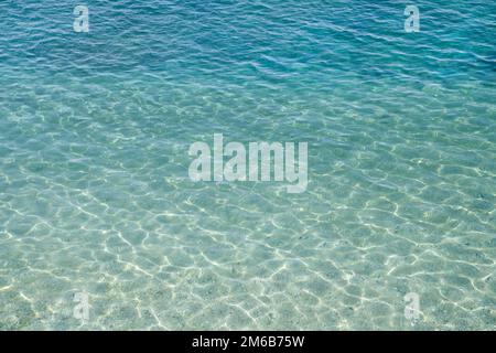 Background of water surface, sun's rays shimmer on water surface, top view Stock Photo