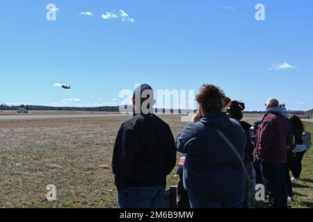 Southwick Massachusetts Boy Scout Troop 338 and accompanying family members watch an F-15C Eagle takeoff during a tour of the 104th Fighter Wing April 22, 2022, at Barnes Air National Guard Base, Massachusetts. Tours provide an opportunity to strengthen relationships while highlighting the unique mission and skillset of the 104FW to the surrounding community and community partners. Stock Photo