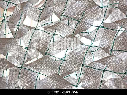 Winter camouflage netting for soldiers of the Ukrainian army Stock Photo