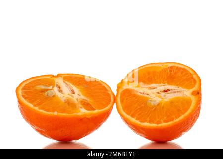 Two halves of sweet organic tangerine, macro, isolated on white background. Stock Photo