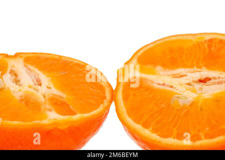 Two halves of sweet organic tangerine, macro, isolated on white background. Stock Photo