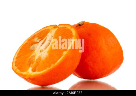 Two halves of sweet organic tangerine, macro, isolated on white background. Stock Photo