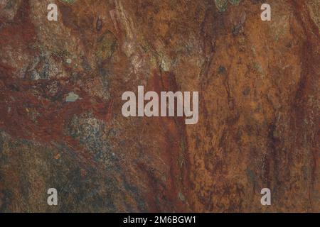 Hard rock wall textured background that has a vintage rusty old grunge effect perfect for an abstract use in the back of other image elements. Stock Photo