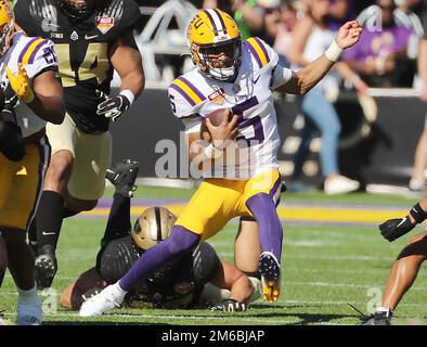 USA. 02nd Jan, 2023. LSU quarterback Jayden Daniels scrambles away from Purdue defenders during the first half of the Cheez-It Citrus Bowl. (Stephen M. Dowell/Orlando Sentinel/TNS/Sipa USA) Credit: Sipa USA/Alamy Live News Stock Photo