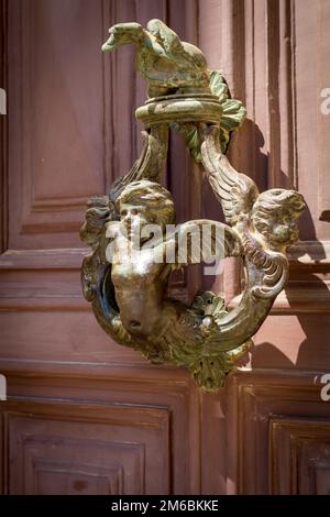 Cherub ornate Bronze door knocker Stock Photo