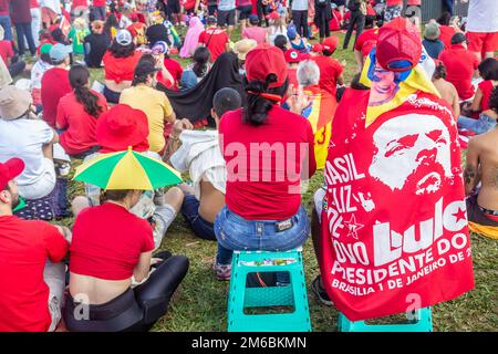 Brasília, DF, Brazil – January 01, 2023: Supporters of President Lula accompanying the President-elect's inauguration speech. Stock Photo