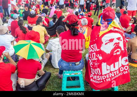 Brasília, DF, Brazil – January 01, 2023: Supporters of President Lula accompanying the President-elect's inauguration speech. Stock Photo