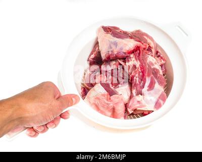 Fresh red lamb meat in a colander Stock Photo