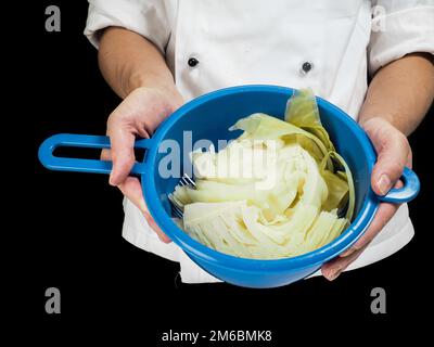 Freshly made boiled parted cabbage in a colander Stock Photo