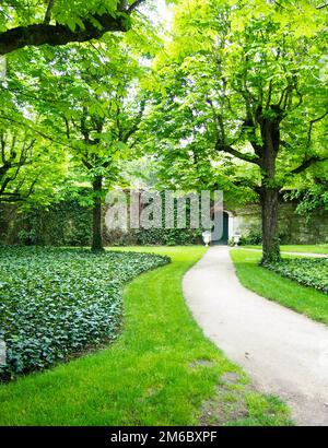 Path to Green Door Secret Garden Stock Photo