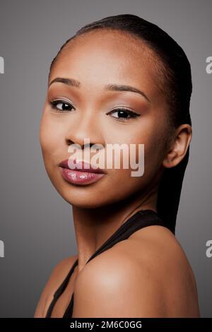 Beautiful face of black Asian blasian woman with cosmetics makeup Stock