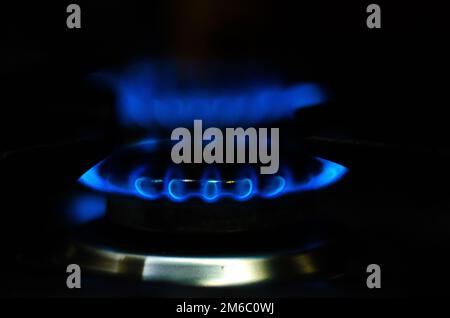 Flame gas of a burning stove in the dark. Stock Photo