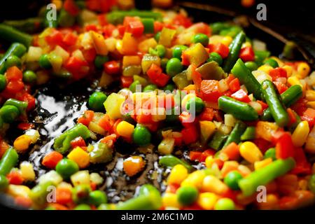 Close up stir fried vegetables in a chinese wok Stock Photo