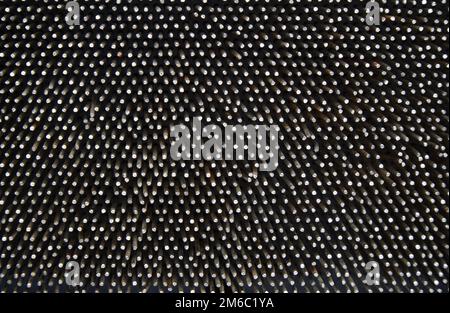Dark worn rusty metal nails texture background. Stock Photo