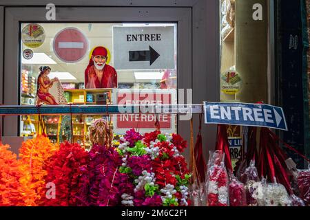 Colorful street wares and signs at Passage Brady, Paris, 2022. Stock Photo