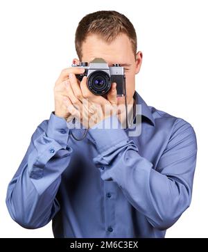 Handsome young man holding a vintage camera. Isolated Stock Photo