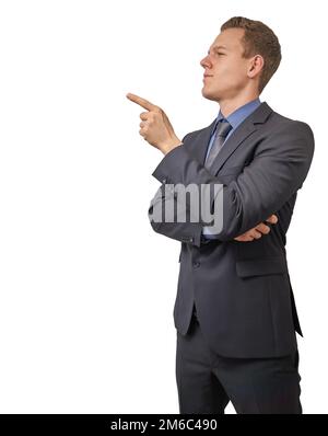 Young businessman points with his finger to his right - isolated with copyspace. Sceptical, critical or analyzing expression for Stock Photo