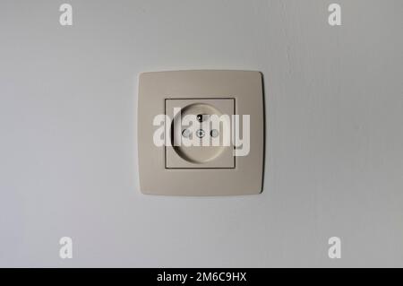 Standard socket in a house with a touch of dirt after long use Stock Photo